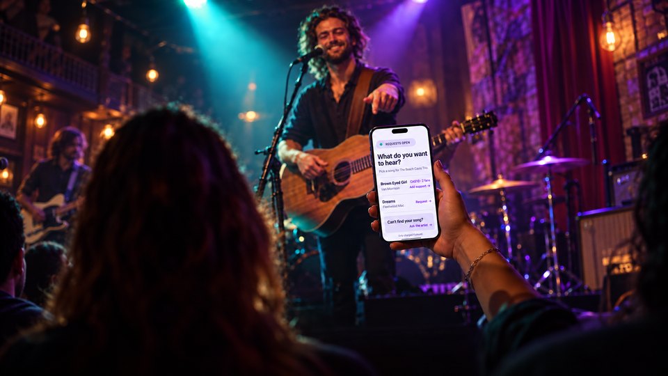 A fan using Tiplor Song Requests from their phone while a musician performs on stage